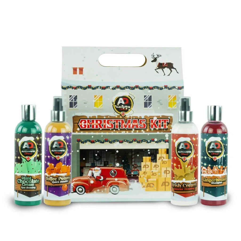 Autobrite Direct Set of Christmas-themed bottles with a decorative box in the background