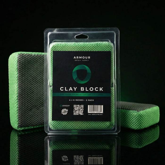 Green clay block with packaging on a black background